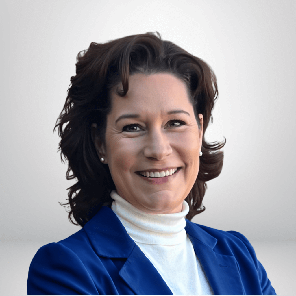Portrait of a Kate S. O’Brien in a blue blazer against a gray background.