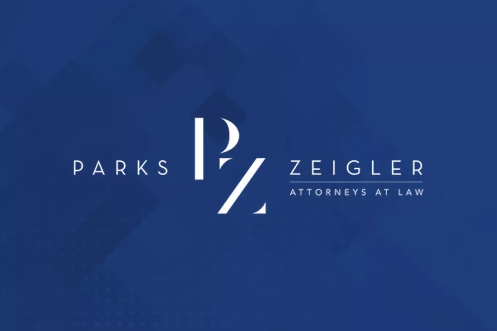 Logo of Parks Zeigler, Attorneys at Law, featuring initials PZ in white on a dark blue background.