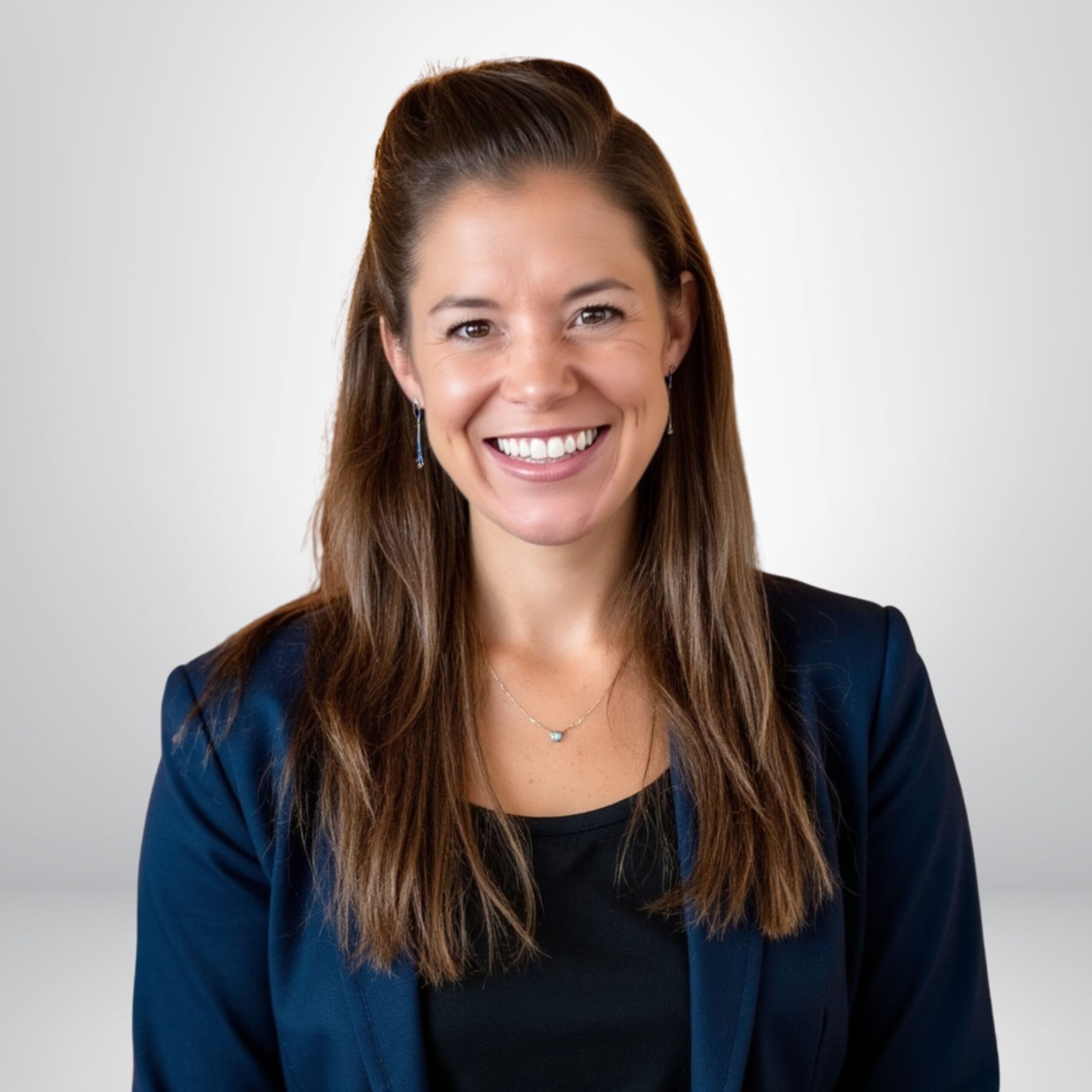 Smiling Professional Woman in a Blue Blazer Against a Light Background