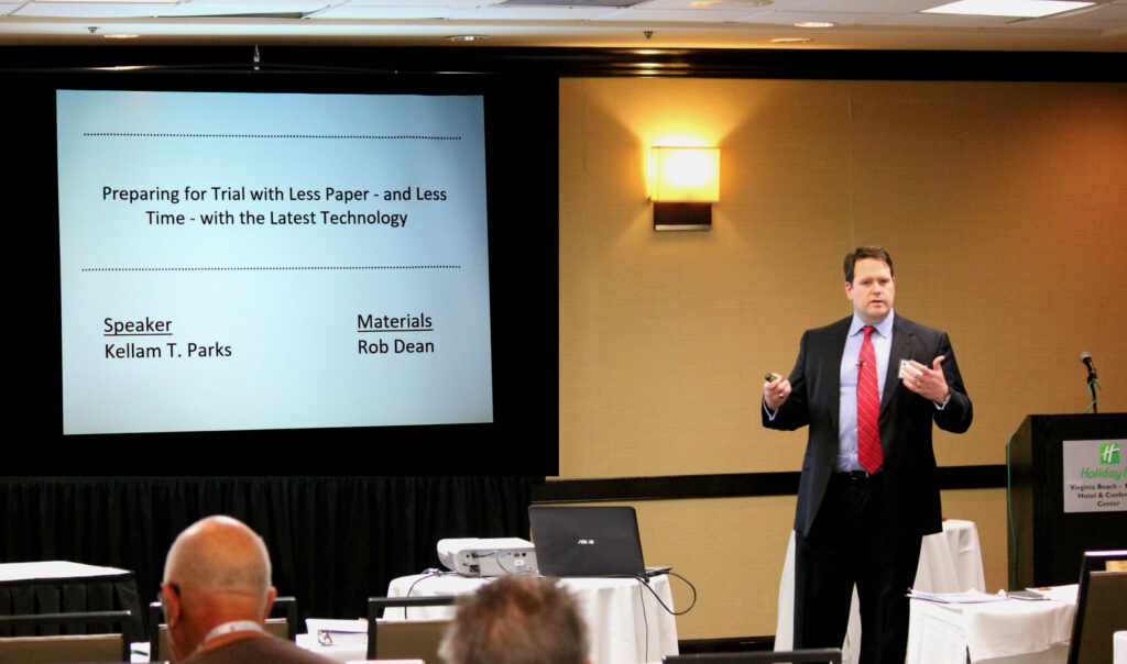 Man Presenting on Reducing Trial Prep Time with Technology in a Conference Room