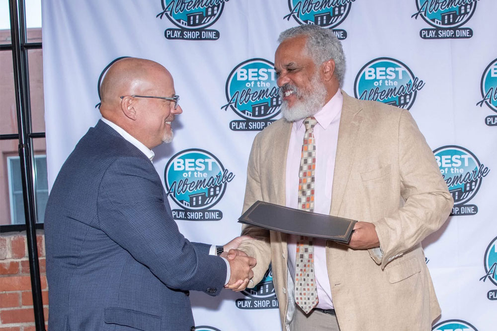 parks-zeigler-pllc-named-best-law-firm-in-2025-best-of-the-albemarle-awards-2 – Parks Zeigler, PLLC Two Men Shaking Hands at the Best of the Albemarle Event One Holding an Award Certificate